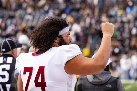 A football player pumps his fist in the air.