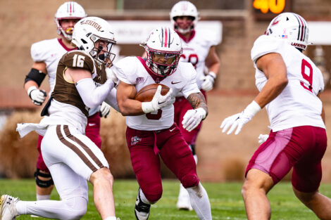 A Lafayette football player carries the football.