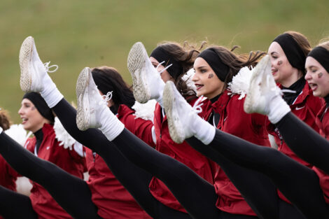 Dancers in a high-kick.