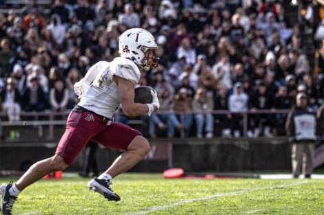 A Lafayette football player carries the football.