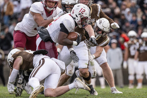 A Lafayette football player carries the football.