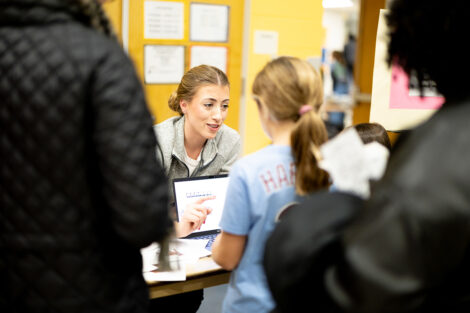 Sofia Serrano, assistant professor of computer science, and Lauren Biernacki, assistant professor of electrical and computer engineering/computer science at a table during Computer Science Night