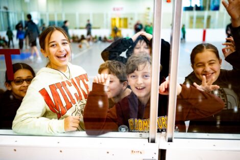 A group of Easton students laughs in Kirby Sports Center.