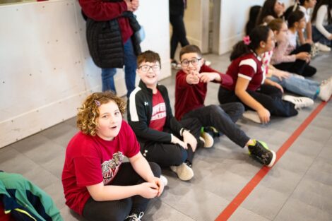 A group of Easton students is all smiles in Lafayette gear, waiting for the School Day Game.