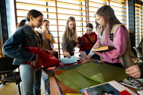 Girl Scouts building a book during Lafayette's Girl Scout Badge Day