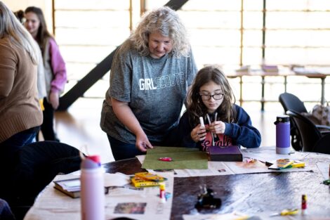 Girl Scout building a book during Lafayette's Girl Scout Badge Day