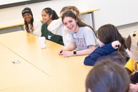 Close-up of Girl Scouts and Lafayette student interacting during Girl Scout Badge Day activities