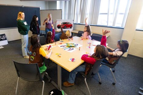 Girl Scouts and Lafayette faculty engaging in discussion during Lafayette's Girl Scout Badge Day