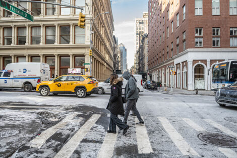 Students and an alum cross a street in NYC