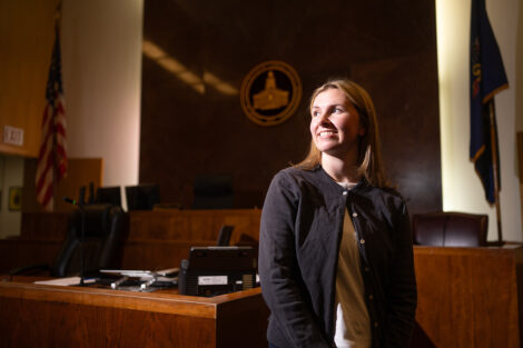 A student in a courtroom for her internship.