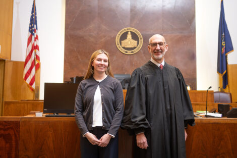 A student and Hon. Reichly in a courtroom.