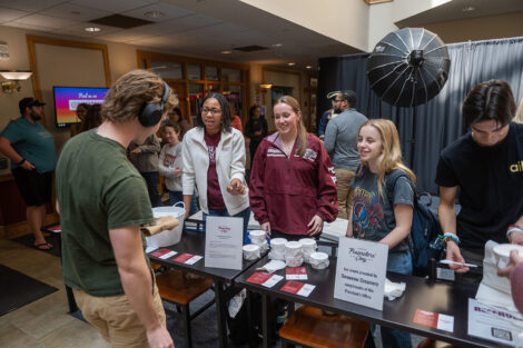 Members of LSAC hand out ice cream to students