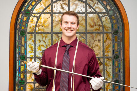 Tyler Roberts raises the Marquis de Lafayette sword.