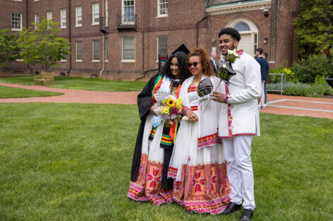 Graduates embrace their family and friends.