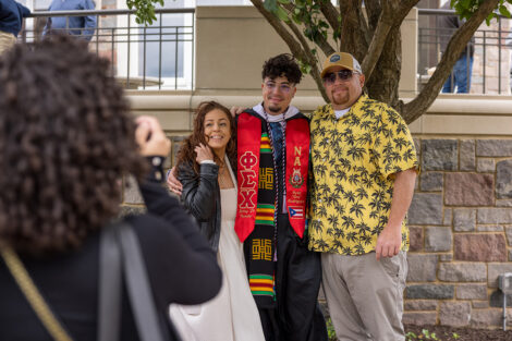 Graduates embrace their family and friends.