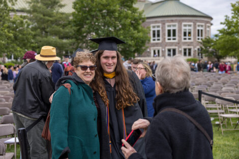 Graduates embrace their family and friends.