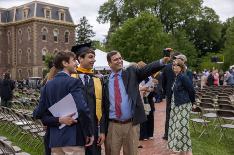 Graduates embrace their family and friends.