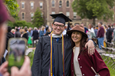 Graduates embrace their family and friends.