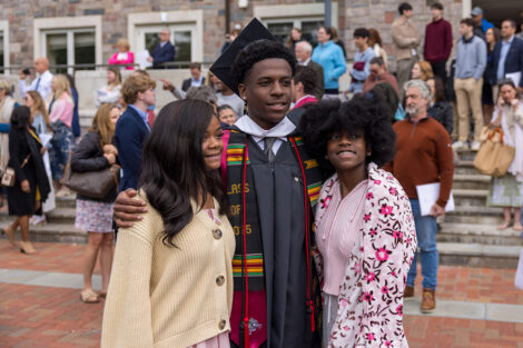 Graduates embrace their family and friends.