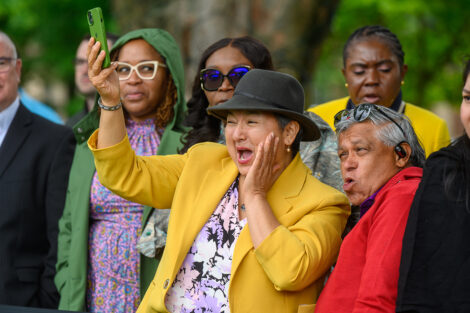 Family members cheer from the crowd.