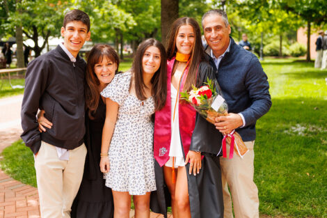 Graduates embrace their family and friends.