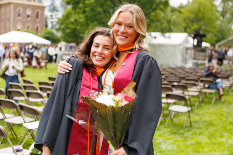 Graduates embrace their family and friends.