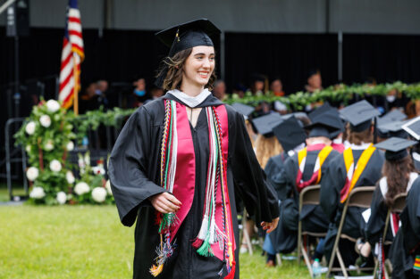 A graduate smiles