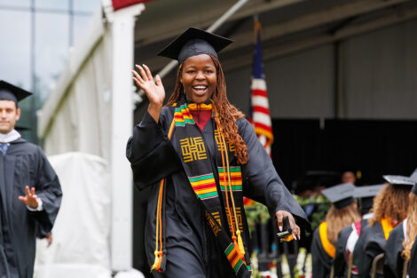 A graduate waves