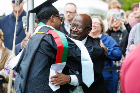 Graduates embrace their family and friends.