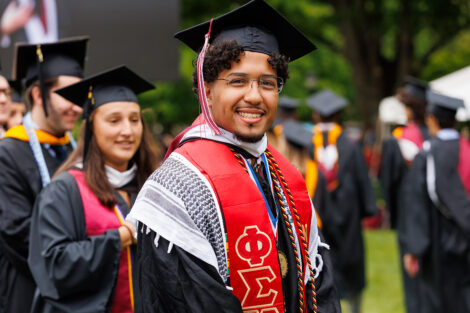 A graduate smiles