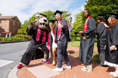 Lead by the Leopard, rows of faculty, staff, and students process into Commencement.