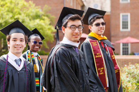 A graduate smiles