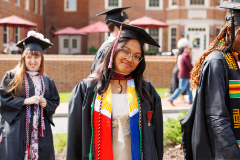 A graduate smiles