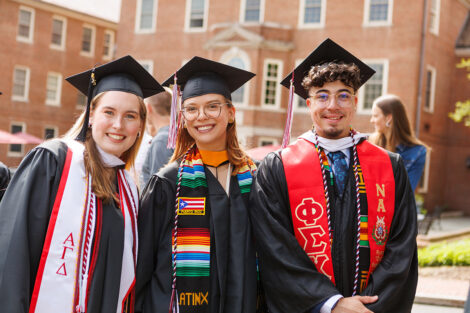A graduate smiles