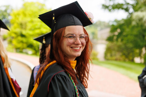 A graduate smiles
