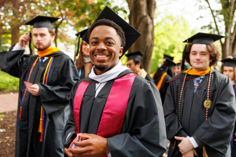 A graduate smiles