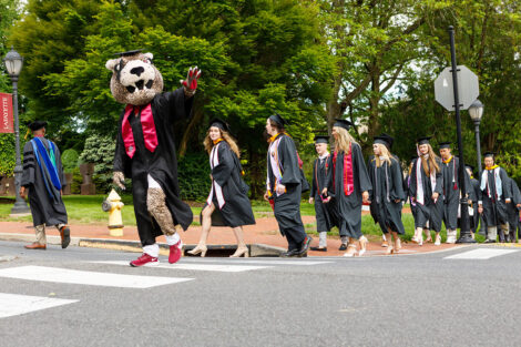 Lead by the Leopard, Rows of faculty, staff, and students process into Commencement.