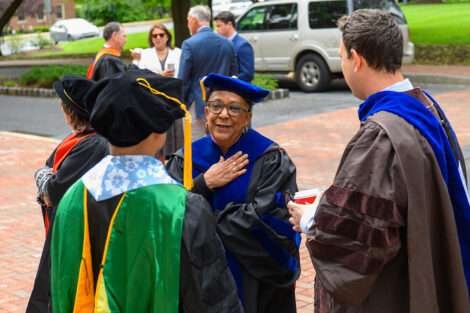 Faculty members interact.