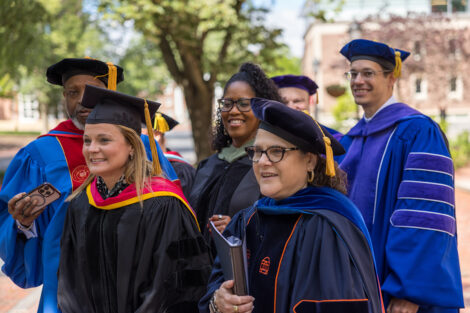 Rows of faculty, staff, and students process into Commencement.