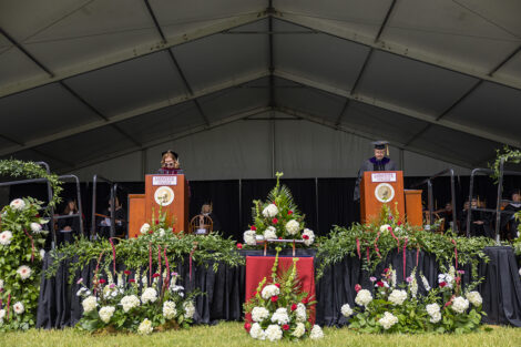 President Nicole Hurd at the left podium and Chair of the Board of Trustees Bob Sell ’84, H’18 at the right podium.