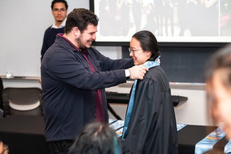 A student receives their stole at the APPI Celebration