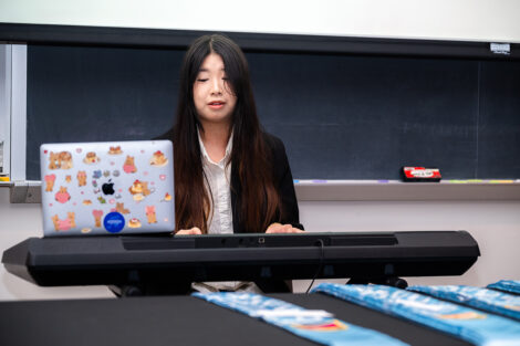 A student plays the keyboard at the AAPI celebration