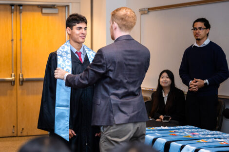 A student receives their stole at the APPI Celebration