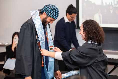 A student receives their stole at the APPI Celebration