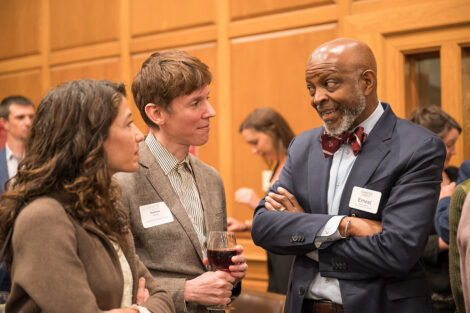 Ernest talks with faculty members