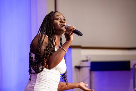 A student sings at Baccalaureate