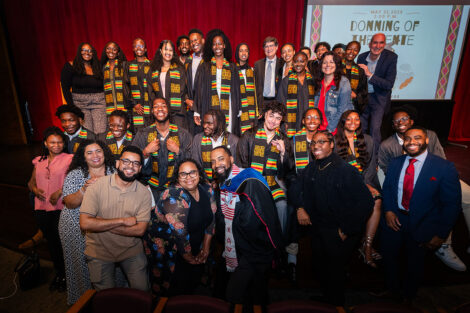 Students smile at the Donning of the Kente