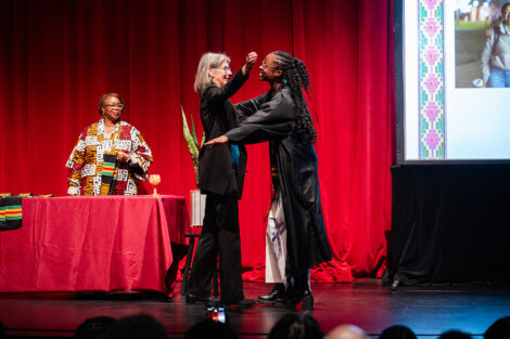 A student gets a stole at the Donning of the Kente