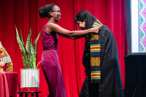 A student gets a stole at the Donning of the Kente