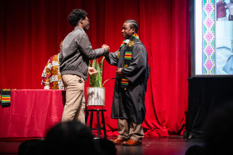 A student gets a stole at the Donning of the Kente